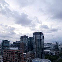 Fototapeta premium Modern buildings in city against cloudy sky
