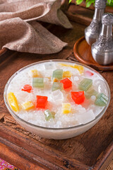 Bubur Cha Cha dessert made from tapioca pearls, sweet potato, taro, tapioca jelly, sugar palm fruit and coconut milk. 