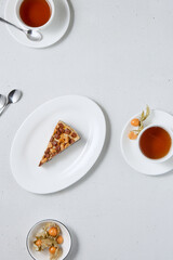 Minimalist Dessert and Tea Composition Subtle Elegance in White and Warm Tones