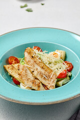 Vibrant Caesar Salad with Grilled Chicken Fillet in Turquoise Plate