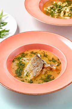 Artistic Culinary Photo Uha and Noodle Soups Highlighting Rustic Elegance