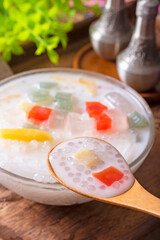Bubur Cha Cha dessert made from tapioca pearls, sweet potato, taro, tapioca jelly, sugar palm fruit and coconut milk. 