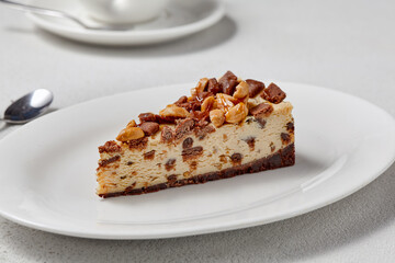 Decadent Slice of Cheesecake with Nut Topping in Soft Focus