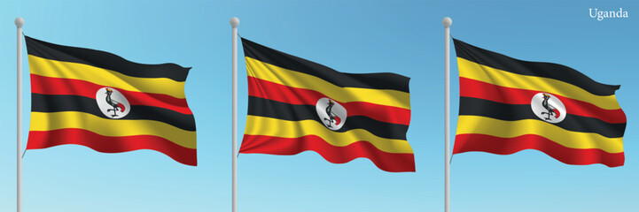 Set of three flags of Uganda waving on flagpoles