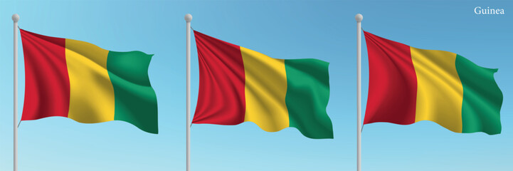 Set of three flags of Guinea waving on flagpoles