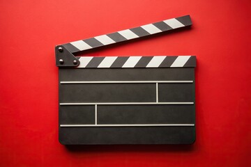 Fototapeta premium Movie slate on red background