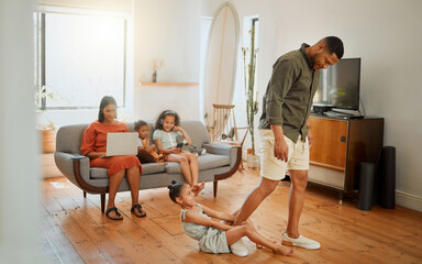 Happy, home and child on leg of father for playing, fun and goofy joke together in living room....