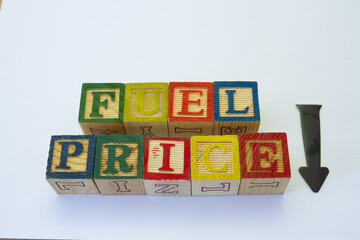 The phrase fuel price down displayed visually on a clear background with copy space