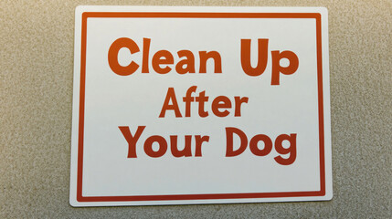 Fototapeta premium Clean up after your dog sign promoting responsible pet ownership