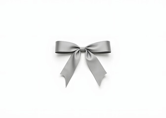 White background with a silver ribbon bow is visually striking and elegant in its simplicity and design elements.