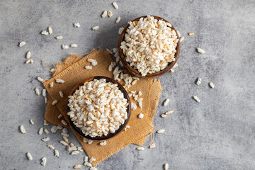 Khoi is a puffed rice snack, light and crispy, commonly enjoyed in Bengal, used in traditional dishes and rituals.