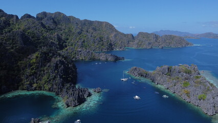 Fototapeta premium Drone photo of lagoons surrounding by mountains 