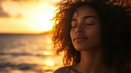 A serene woman of Latin descent relaxes on the beach at sunset eyes closed embracing the fresh breeze and the beauty of her mixed hair
