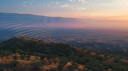 Fototapeta premium Sound waves radiating across a serene landscape, symbolizing the interconnectedness and harmony of natural and auditory elements.