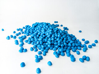 Hot cutting type masterbatch granules, blue plastic raw material resin coloring pigment granules, isolated with full color background for industrial plastic company profile product catalog design