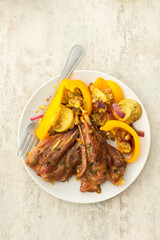 Enjoy a hearty breakfast or lunch with baked turkey served alongside roasted zucchini, sweet peppers, and onions