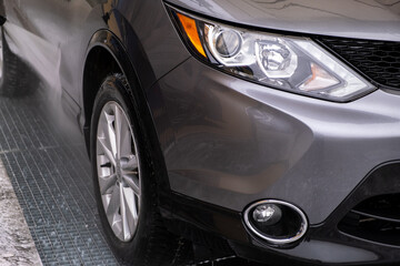 SUV Being Washed at Car Wash