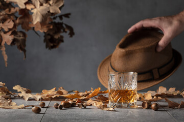 Whiskey in crystal glass on a grey stone table.