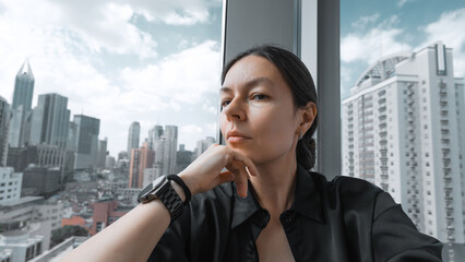 Fototapeta premium a young woman at the window
