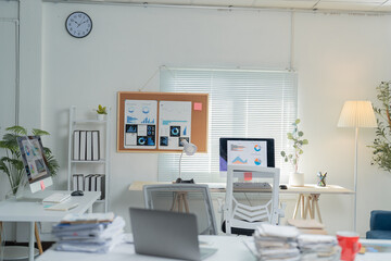 Natural light is illuminating this modern office interior designed for a small team working with data analysis and business strategy