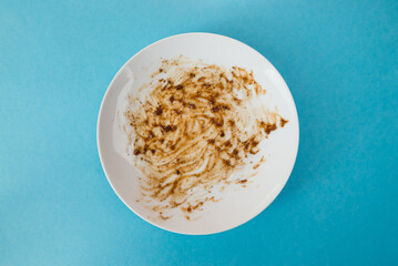 dirty plate isolated on blue background.