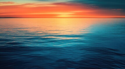 Obraz premium A calm ocean scene at sunset featuring vivid colors shimmering on the water capturing a sense of peace and elegance