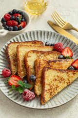 french toasts with honey and fresh berries