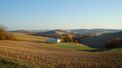 Obraz premium A picturesque harvest storage area with a backdrop of rolling hills and a clear blue sky, perfect for Thanksgiving.