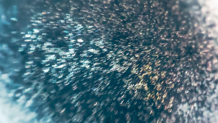 Colorful Christmas glitter. Abstract glowing backdrop noise texture. Glitter design background