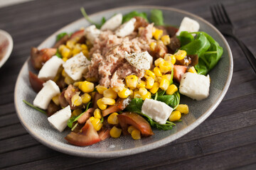Closeup of salad with fish and vegetables for lunch