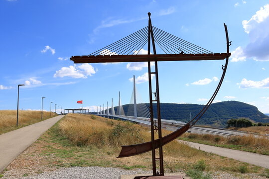 Millau, France, Europe - September 02 2024: cars crossing the multispan cable stayed Millau Viaduct across gorge valley of Tarn River