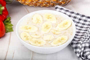 Sweet porridge with banana breakfast