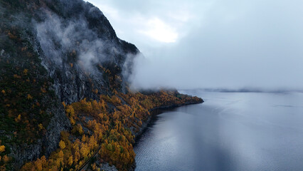 Drone Aerial View of Misty Norwegian Fjord in Autumn