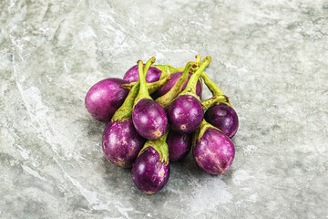Small organic young purple round eggplant