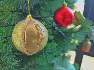 Golden Christmas Ornament on Tree 