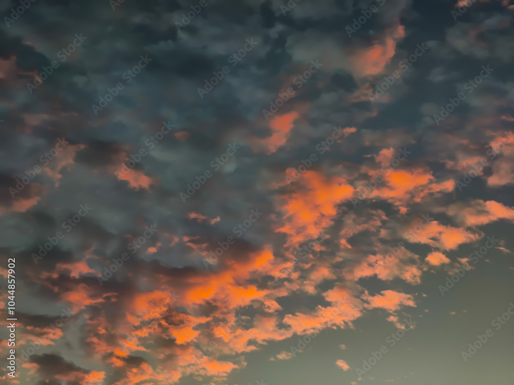 Wall mural beautiful sunset with clouds in the sky. nature background and texture.