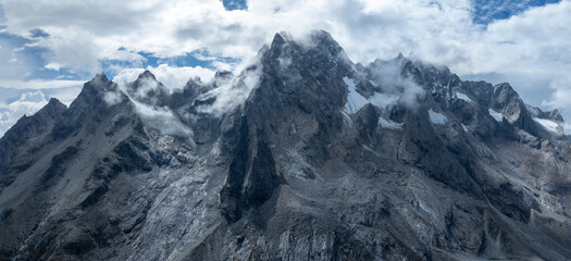 Aerial view of beautiful high altitude snow capped mountain landscape