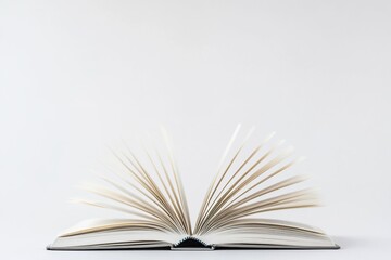 Fototapeta premium Open book with moving pages, light gray cover, isolated on white background.