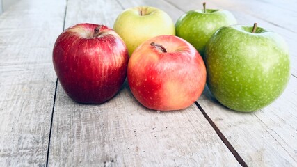 A variety of fresh apples, red, green, and yellow. Healthy eating background.