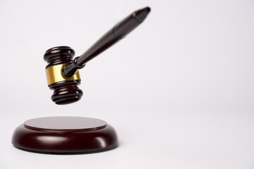 Judge gavel on a white background with copy space, close-up. Justice concept