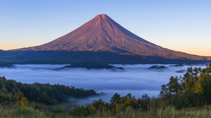 Majestic Mountain Above Foggy Landscape at Sunrise