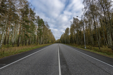 Fototapeta premium A road with trees in the background