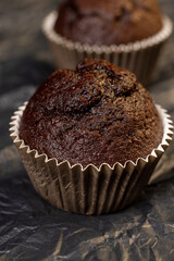 fresh and soft black chocolate cupcake on black paper