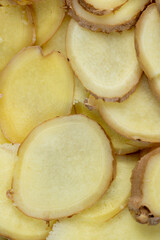details of the ginger root used in cooking sliced into pieces