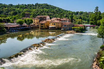 Summer on the Mincio river. Historic village of Borghetto sul Mincio