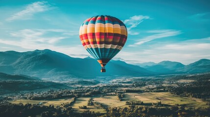 Obraz premium Colorful Hot Air Balloon over Scenic Landscape