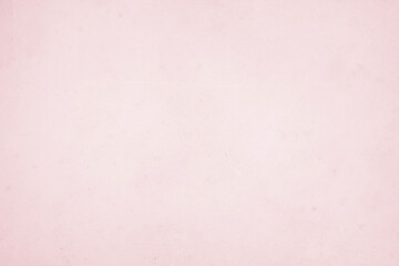 A vintage pink paper texture background with a grunge feel, perfect for art and design projects.