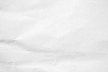 Obraz premium Crumpled white paper texture with a soft, wintery feel, perfect for backgrounds and design.