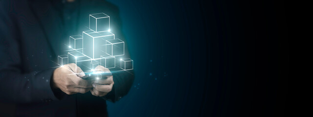 Businessman using smartphone for a smart contract and executing a cryptocurrency transaction with...