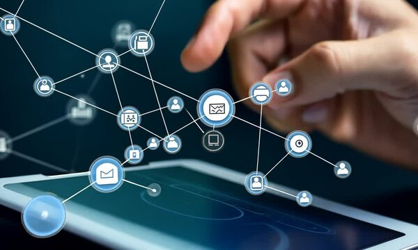 Hand interacting with digital network icons on a touchscreen device.